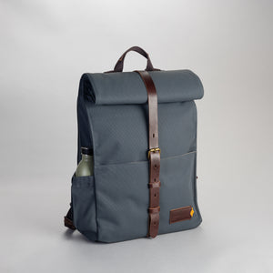 Property Of... Alex 24h Backpack stone blue sustainable travel front pack shot 
