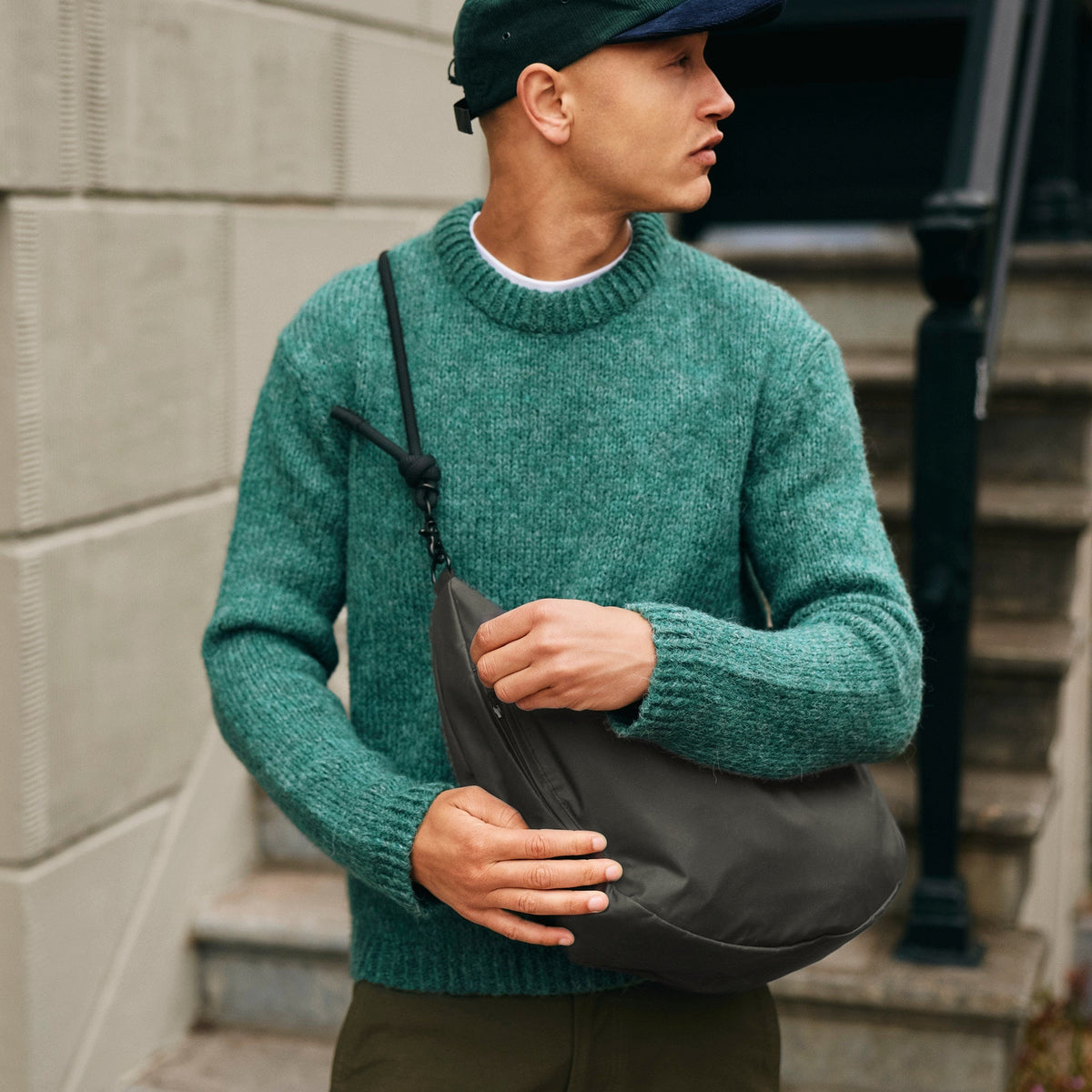 Lea Sling Bag Dark Forest worn across the body