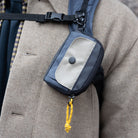 Ian Coin Pouch Coal Navy Khaki worn on a coat