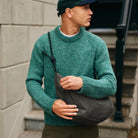 Lea Sling Bag Dark Forest worn across the body