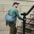 Lea Sling Bag Ocean Blue worn across the body